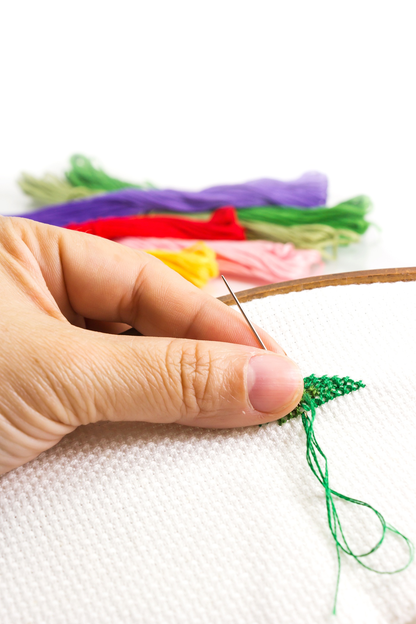 Close-up of hand embroidery with metallic threads
